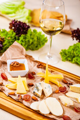 Appetizer. Cheese platter with honey, nuts and grape