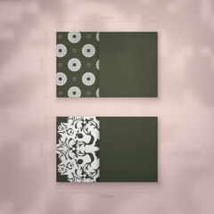 Business card in dark green color with Indian white ornaments for your contacts.