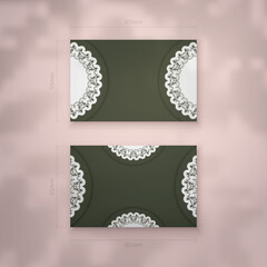 Business card template in dark green color with a luxurious white pattern for your business.