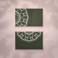 Business card template in dark green color with an abstract white pattern for your contacts.
