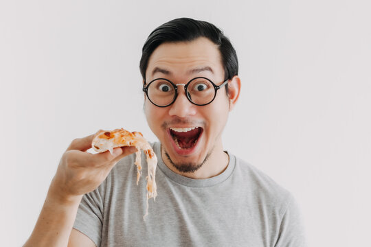 Funny Face Nerd Asian Man Has Cheesy Pizza Isolated On White Background.