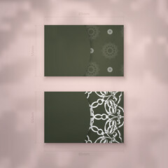 Business card template in dark green color with luxurious white ornaments for your brand.