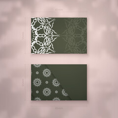 Business card template in dark green color with vintage white ornament for your contacts.