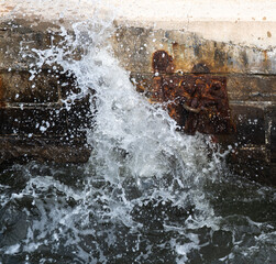 Splashing water on rusted dock