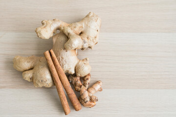 Various spices on a wooden table. Ginger, cinnamon, ginger on a wooden board.