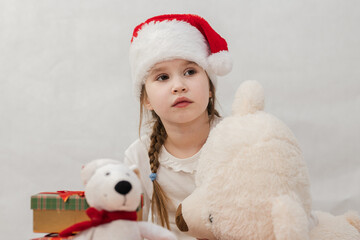 New Year's holiday. Portrait of a little girl with a Christmas style and gifts.