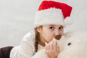 New Year's holiday. Portrait of a little girl with a Christmas style and gifts.