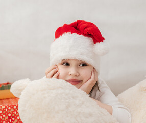 New Year's holiday. Portrait of a little girl with a Christmas style and gifts.