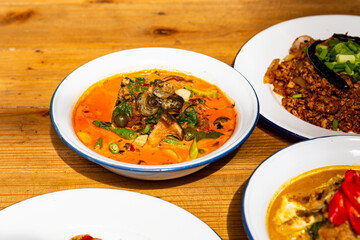 River snail red curry in red curry coconut milk soup in bowl. Thai Food