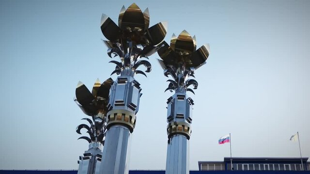 Elista, Russia - Jun 04, 2019: Fountain Three Lotus tops in the central square of Elista-city named after Lenin. Kalmykia Republic, Russia.