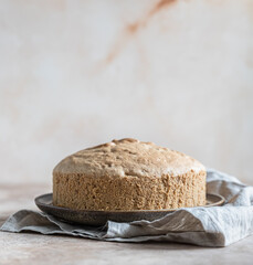 Homemade sponge cake or chiffon biscuit on light concrete background. Biscuit for making cake.