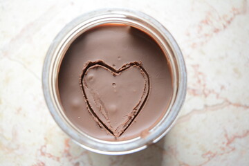 Picture of a heart shape on the surface of chocolate spread