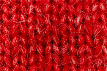 Knitted wool texture. Red Christmas background. 
