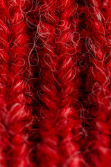 Knitted wool texture. Red Christmas background. 