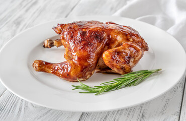 Roasted chicken on the white plate