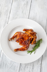 Roasted chicken on the white plate