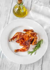 Roasted chicken on the white plate