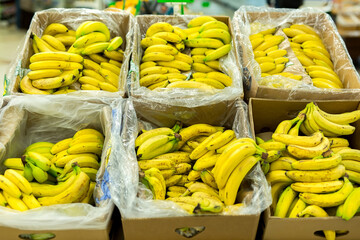 Bananas in the boxes in the supermarket