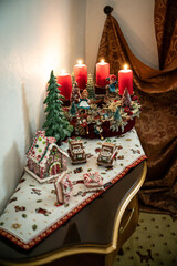 Christmas table composition. Beautiful decoration. Christmas trees, candles, stars, lights and elegant accessories. Merry Christmas and Happy Holidays, Template.