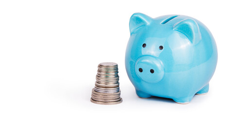 Piggy bank and stack of coins on white background. Money box copy space