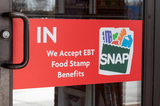 SNAP and EBT Accepted here sign. SNAP and Food Stamps provide nutrition benefits to supplement the budgets of disadvantaged families.