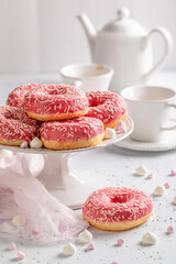 Tasty and colorful pink donuts and coffee as best dessert.