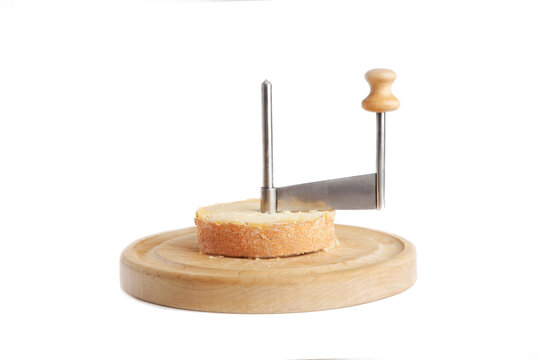 Shaving tete de moine cheese using girolle knife. Monks head. Variety of  Swiss semi-hard cheese made from cows milk Stock Photo - Alamy