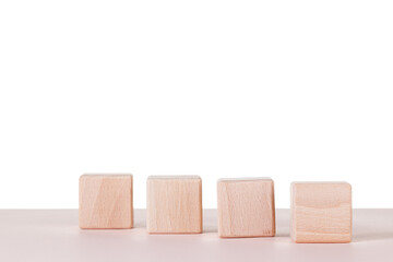 Four wooden cubes on a white background