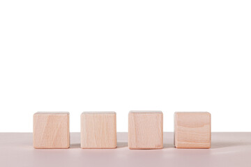 Four wooden cubes on a white background