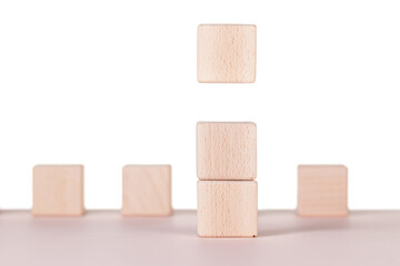 Seven wooden cubes on a white background