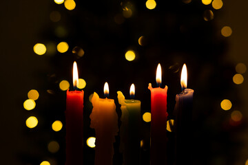 Candlelight Day. Traditional Colombian holiday. Group of candles lit at night with unfocused lights...