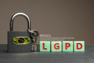 LGPD (brazilian data protection law) concept: lock with brazil flag on a table with some plastic...