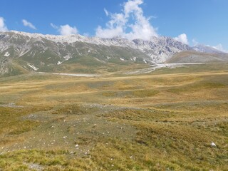 panoramic view of the prairie in Campo Imperatore with the Gran Sasso d'Italia in the background. Called little Tibet