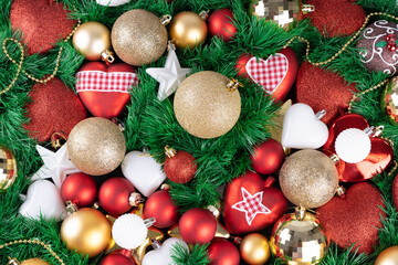 Christmas background with a green tree, red and gold balls. Merry Christmas greeting card concept.