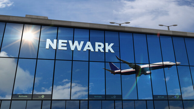 Airplane landing at Newark New Jersey, USA airport mirrored in terminal