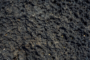 Black volcanic stone macro closeup. High quality photo