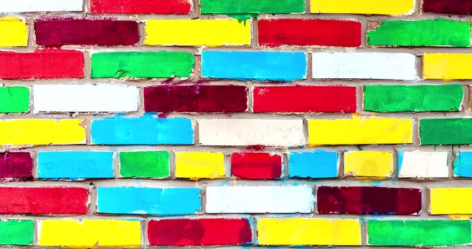Brick wall from multi colored bricks as a creative background