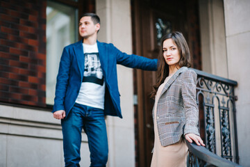 guy and a girl happily walk in the morning on the empty streets