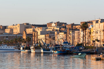 Sea port. Ships and boats at dawn. Sea town. Taranto