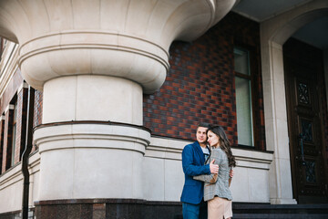 guy and a girl happily walk in the morning on the empty streets