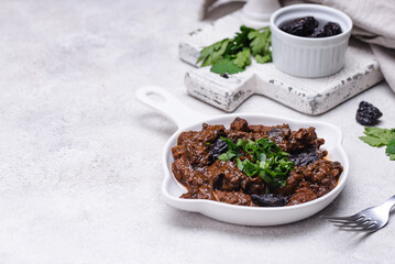 Hot stewed meat with prunes