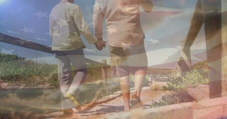Animation of senior caucasian couple holding hands on beach over flag of united states of america - Powered by Adobe