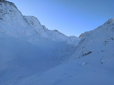 Caltun Lake covered by snow and ice, Fagaras Mountains, Romania