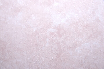 水滴のついてピンクの大理石