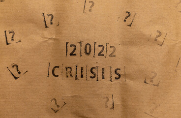 craft paper with 2022 and many stamped questions marks