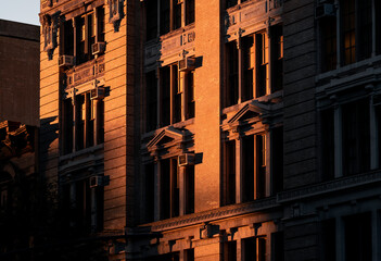 modern building at night in new york condominium apartment windows live house office rental leasing...