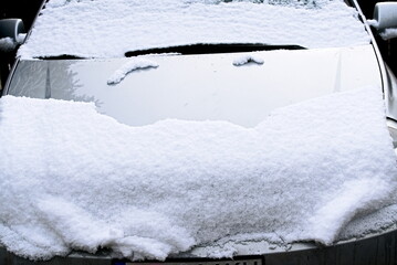 A car covered with snow in the winter 