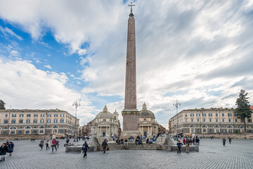 Fototapeta na wymiar The Flaminio Obelisk at Piazza del Popolo. It was built during the kingdom of Pharaohs Ramesses II and Merneptah in 13th century BC and placed in the Temple of Sun in Heliopolis; Rome, 2015