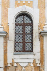 Fototapeta na wymiar Antique window in a stone wall