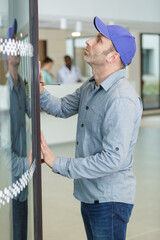 janitor using screwdriver to carry out hospital maintenance